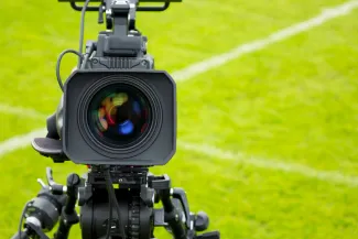 Press camera on a football pitch