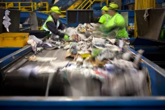 Workers at waste management facility